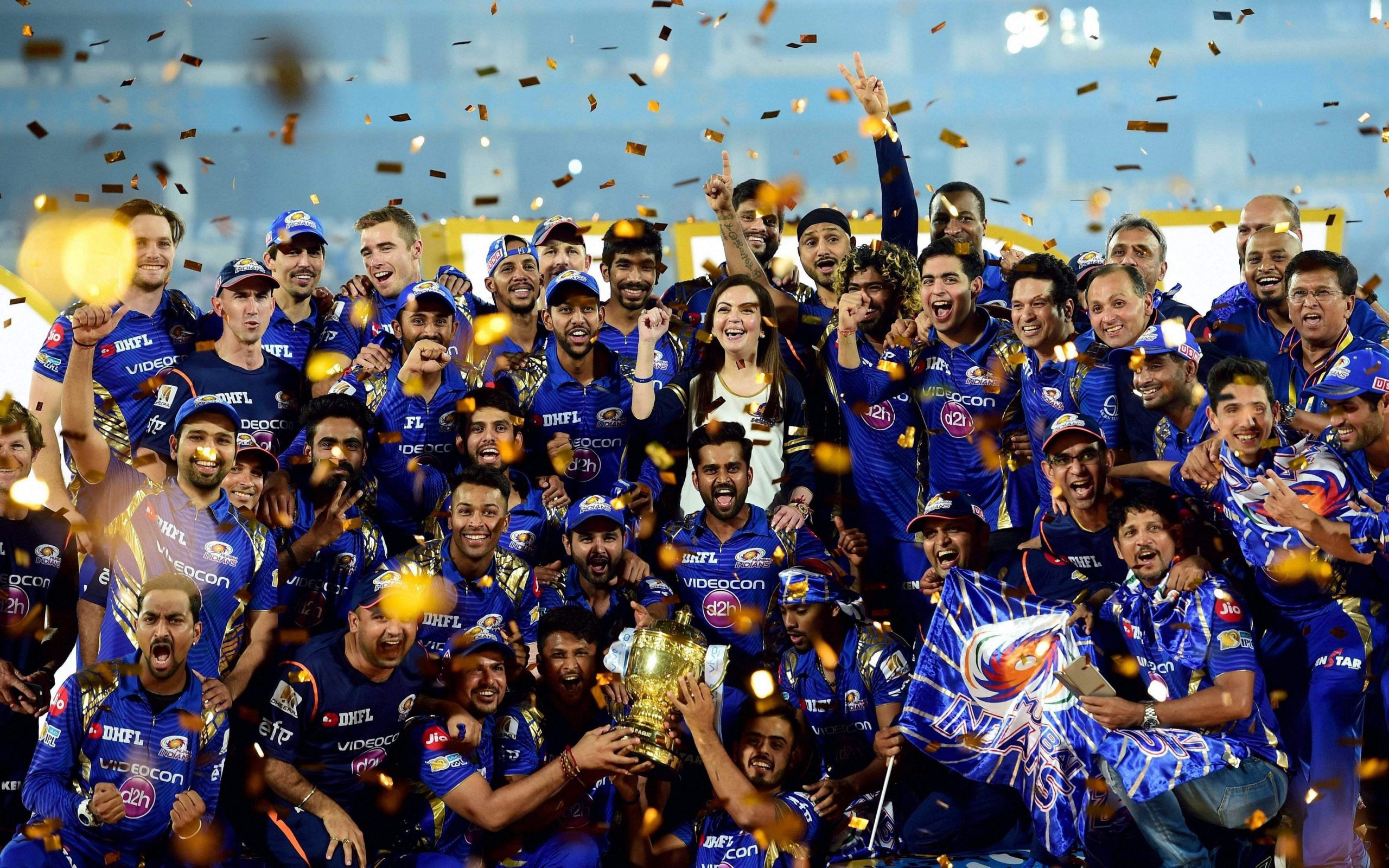 image of the winning team with the IPL trophy and the runners-up team with their medals